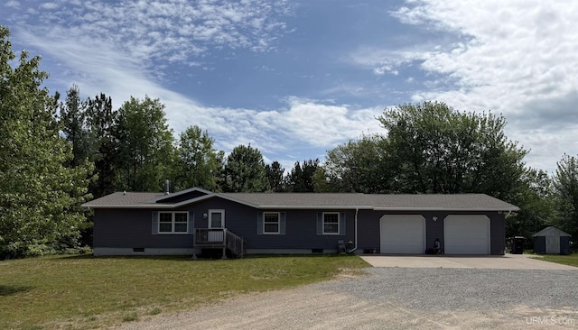 N7722 Candy Cane Rd, Munising, MI 49862 - ranch-style home featuring driveway, a garage, a front lawn, view of wooded area, and a storage unit