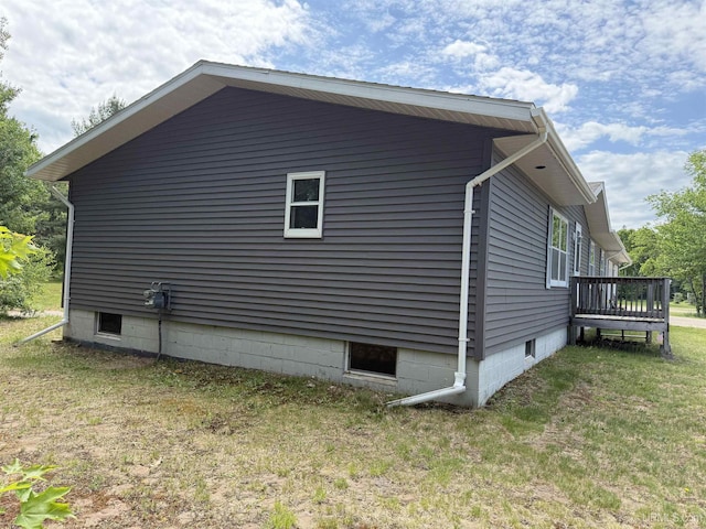 N7722 Candy Cane Rd, Munising, MI 49862 - view of home's exterior featuring a wooden deck and a lawn
