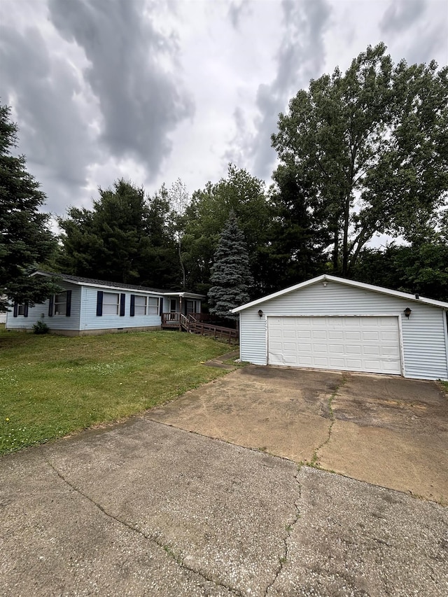 2299 Bart St, Croswell, MI 48422 - view of front of home featuring an outdoor structure, a garage, and a front yard