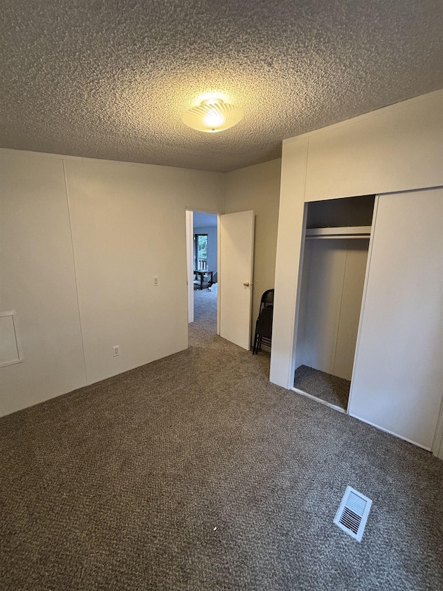 2299 Bart St, Croswell, MI 48422 - unfurnished bedroom featuring carpet, a closet, and a textured ceiling