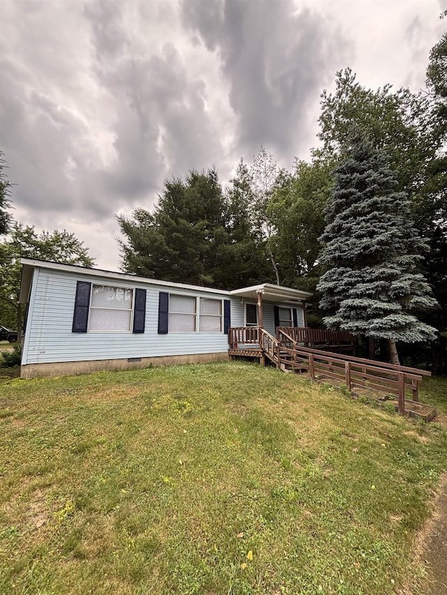 2299 Bart St, Croswell, MI 48422 - view of front facade featuring a front lawn and a deck