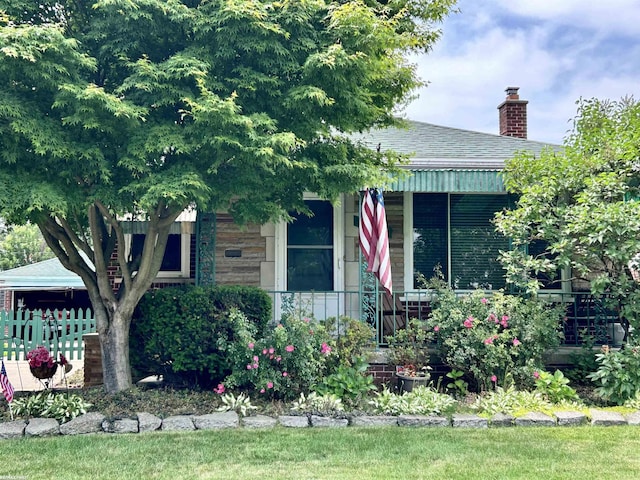 23311 Courtland Ave, Eastpointe, MI 48021 - view of front facade with a chimney and roof with shingles