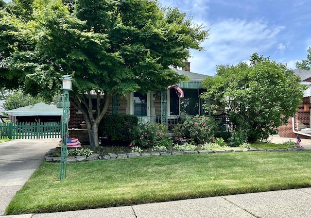 23311 Courtland Ave, Eastpointe, MI 48021 - obstructed view of property featuring a chimney and concrete driveway