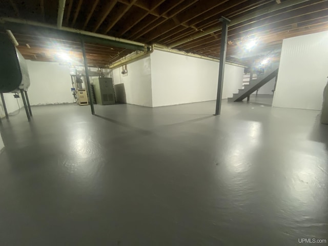 10289 N Lake Rd, Ironwood, MI 49938 - unfinished below grade area featuring stairs