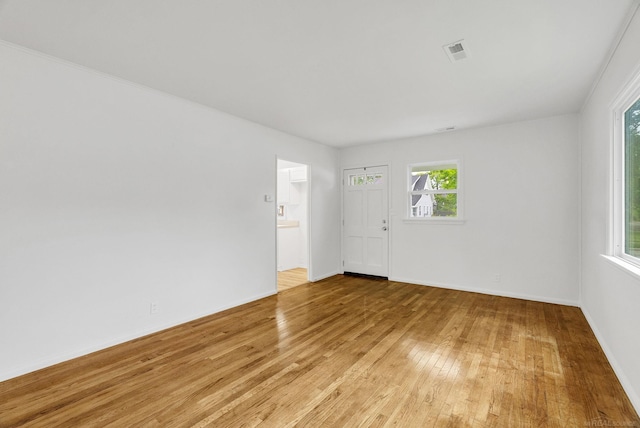 1404 Pine St, Port Huron, MI 48060 - empty room with light wood finished floors and baseboards