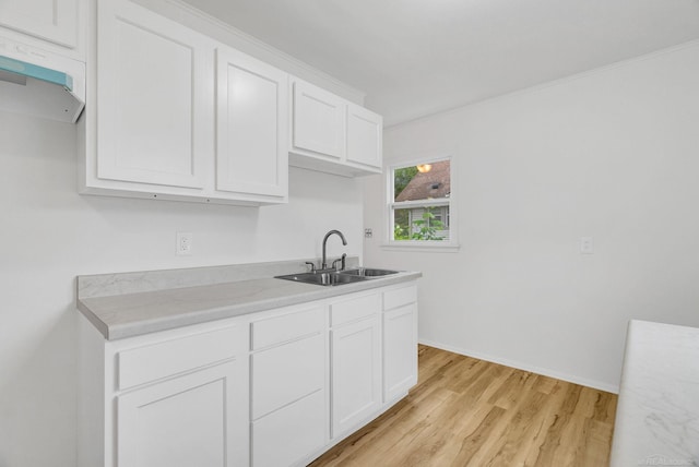 1404 Pine St, Port Huron, MI 48060 - kitchen featuring light wood-style floors, white cabinets, and light countertops