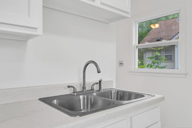 1404 Pine St, Port Huron, MI 48060 - kitchen view of white cabinets and light stone countertops