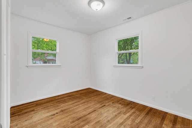 1404 Pine St, Port Huron, MI 48060 - unfurnished room with light wood-type flooring and ornamental molding