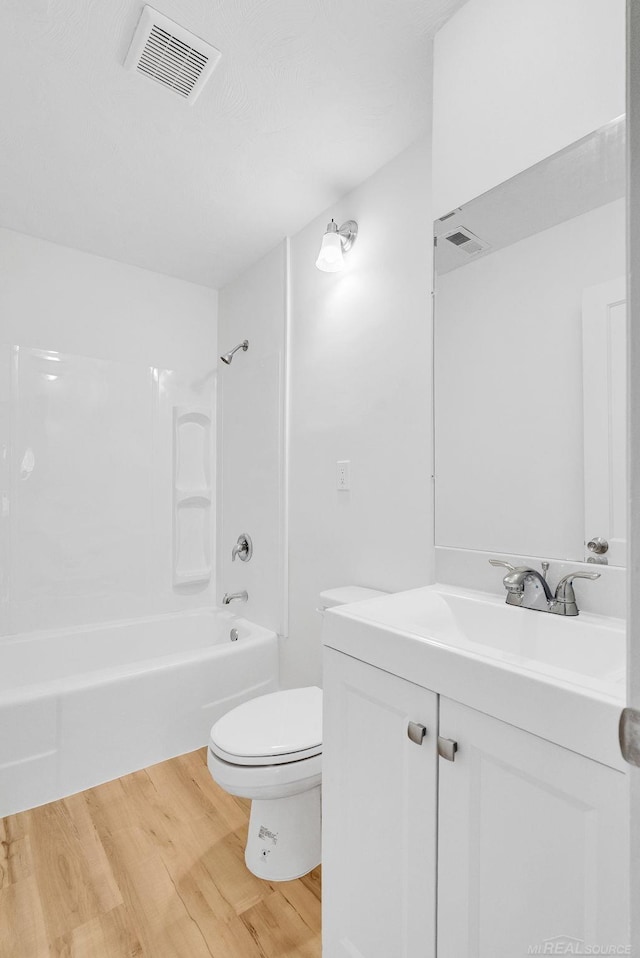 1404 Pine St, Port Huron, MI 48060 - bathroom with vanity, wood finished floors, and bathing tub / shower combination