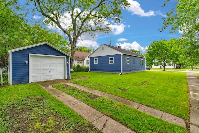 1404 Pine St, Port Huron, MI 48060 - view of side of property with a garage, a yard, an outbuilding, and driveway