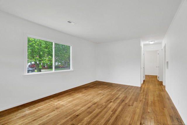 1404 Pine St, Port Huron, MI 48060 - empty room featuring wood finished floors and baseboards