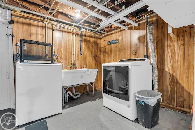 2019 Griswold St, Port Huron, MI 48060 - washroom with wooden walls and separate washer and dryer