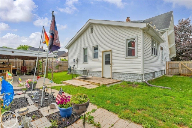 2019 Griswold St, Port Huron, MI 48060 - rear view of property with a chimney, a fenced backyard, and a patio