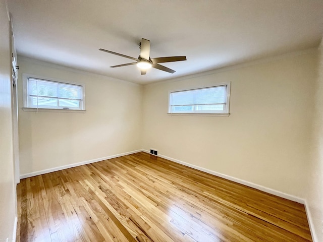 26315 Ursuline St, Saint Clair Shores, MI 48081 - empty room with wood-type flooring, plenty of natural light, a ceiling fan, and crown molding