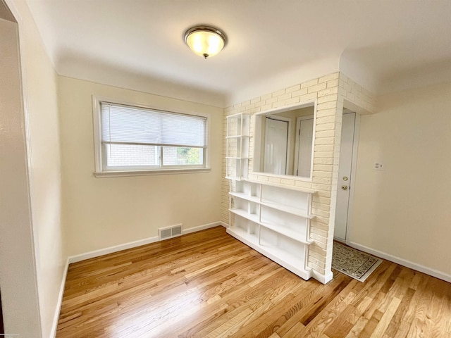 26315 Ursuline St, Saint Clair Shores, MI 48081 - spare room with light wood-type flooring and baseboards