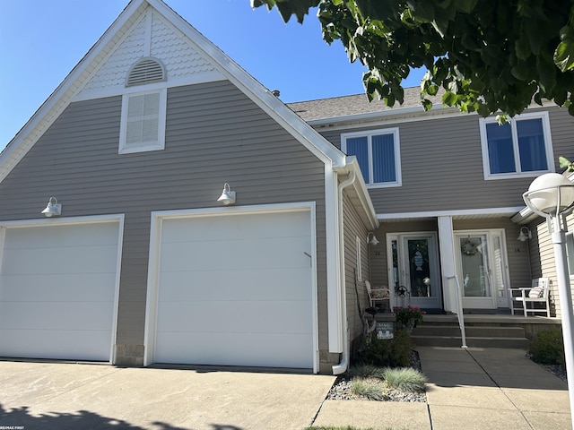15 E Spring Ct Unit 12, Port Austin, MI 48467 - view of front facade with a garage and driveway