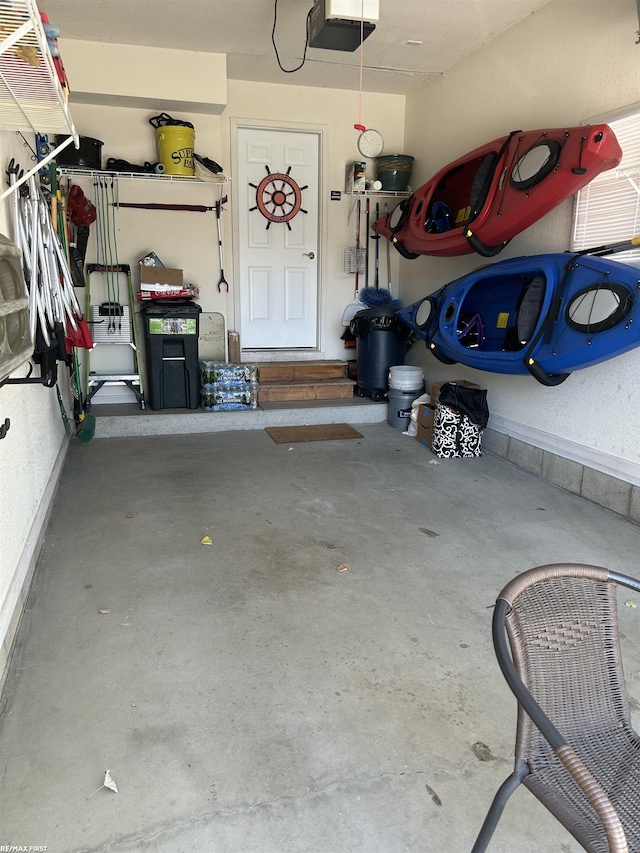 15 E Spring Ct Unit 12, Port Austin, MI 48467 - garage featuring a garage door opener