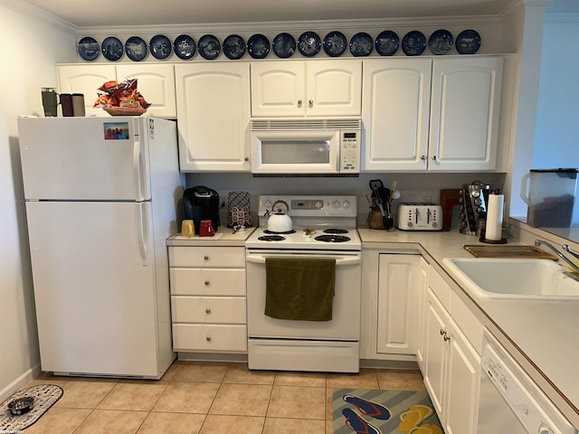 15 E Spring Ct Unit 12, Port Austin, MI 48467 - kitchen with white appliances, light tile patterned flooring, white cabinets, and crown molding