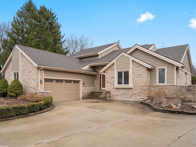 1008 Hidden Ln, Rochester Hills, MI 48309 - view of front of home featuring brick siding, a garage, driveway, and a shingled roof
