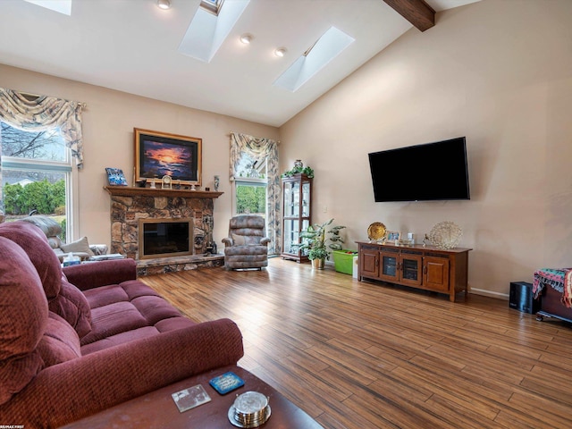 1008 Hidden Ln, Rochester Hills, MI 48309 - living room featuring a skylight, beam ceiling, wood finished floors, healthy amount of natural light, and high vaulted ceiling
