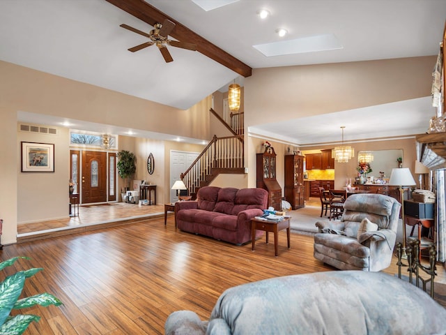 1008 Hidden Ln, Rochester Hills, MI 48309 - living room with beam ceiling, high vaulted ceiling, stairway, hardwood / wood-style floors, and a ceiling fan