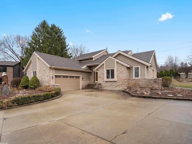 1008 Hidden Ln, Rochester Hills, MI 48309 - view of front of house featuring brick siding, a garage, and driveway