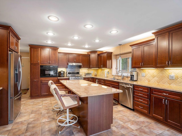 1008 Hidden Ln, Rochester Hills, MI 48309 - kitchen featuring stainless steel appliances, under cabinet range hood, a breakfast bar, decorative backsplash, and a kitchen island