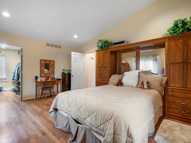 1008 Hidden Ln, Rochester Hills, MI 48309 - bedroom featuring lofted ceiling, light wood-style floors, recessed lighting, and a spacious closet