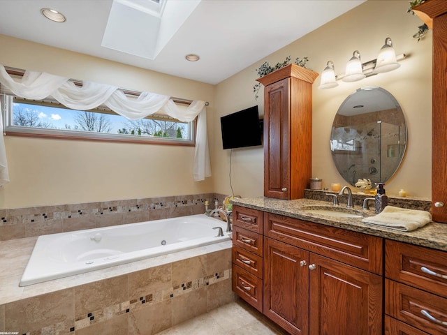 1008 Hidden Ln, Rochester Hills, MI 48309 - full bathroom featuring a skylight, vanity, a whirlpool tub, a stall shower, and tile patterned floors