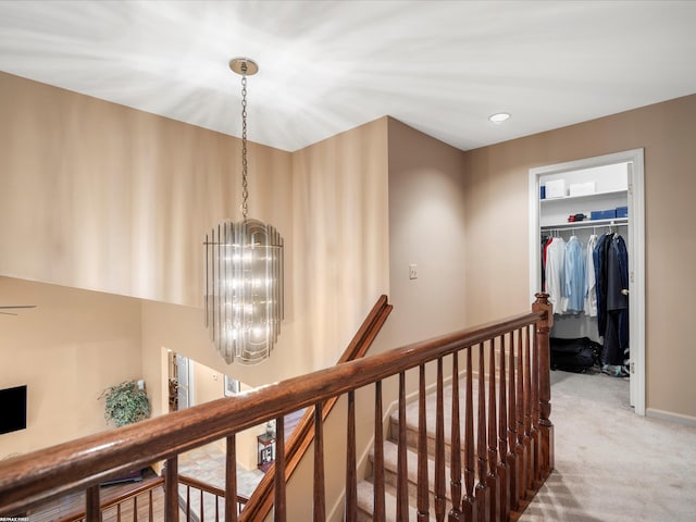 1008 Hidden Ln, Rochester Hills, MI 48309 - corridor featuring a chandelier, an upstairs landing, and carpet floors