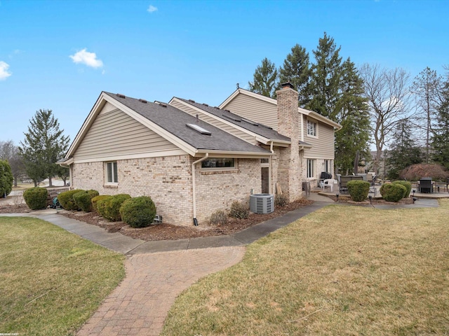 1008 Hidden Ln, Rochester Hills, MI 48309 - view of side of property with a yard, brick siding, a chimney, and a patio