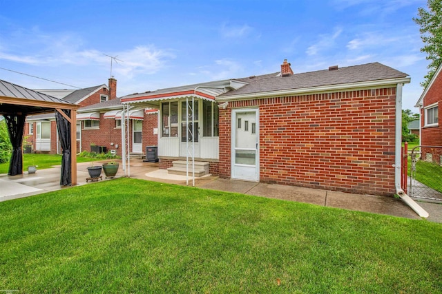 23716 Roxana Ave, Eastpointe, MI 48021 - rear view of property featuring entry steps, a yard, brick siding, and a gazebo