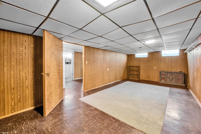 23716 Roxana Ave, Eastpointe, MI 48021 - below grade area featuring tile patterned floors, wood walls, and a paneled ceiling
