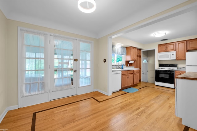 23716 Roxana Ave, Eastpointe, MI 48021 - kitchen with white appliances, light wood-type flooring, french doors, and light countertops