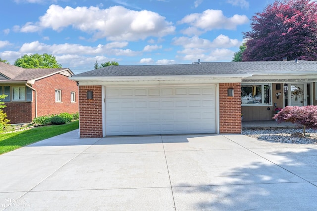 528 Hidden Ln, Grosse Pointe Woods, MI 48236 - view of front facade featuring brick siding, driveway, covered porch, and a garage