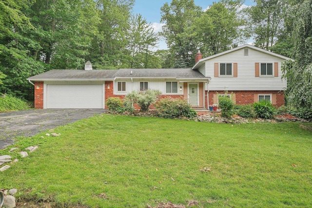 6575 Goldfinch Ln, Clarkston, MI 48346 - tri-level home with a chimney, asphalt driveway, brick siding, an attached garage, and a front yard