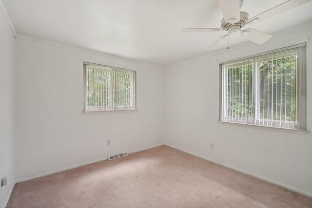 6575 Goldfinch Ln, Clarkston, MI 48346 - empty room with plenty of natural light, light carpet, ceiling fan, and ornamental molding