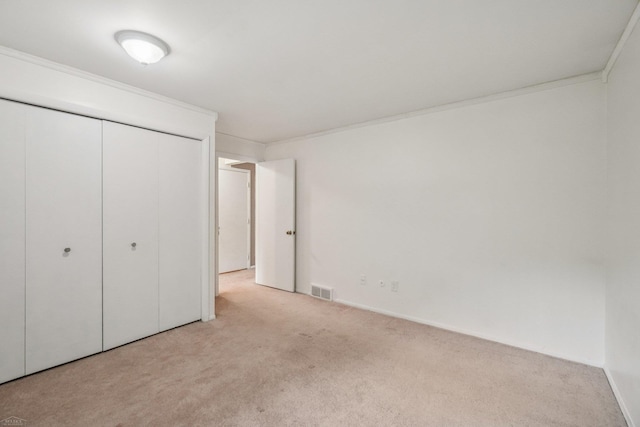 6575 Goldfinch Ln, Clarkston, MI 48346 - unfurnished bedroom featuring carpet, a closet, and crown molding