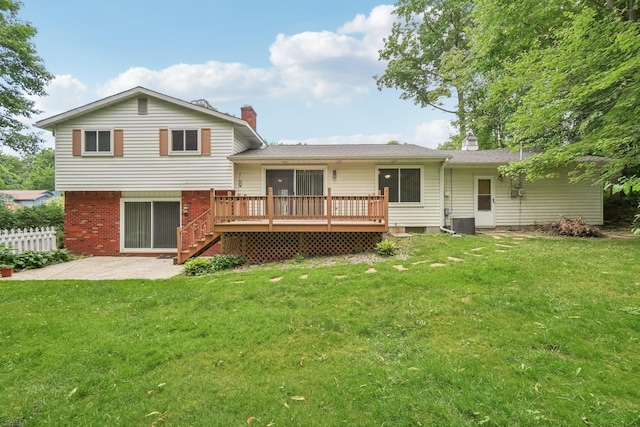 6575 Goldfinch Ln, Clarkston, MI 48346 - rear view of property featuring a chimney, a patio area, a wooden deck, brick siding, and stairs