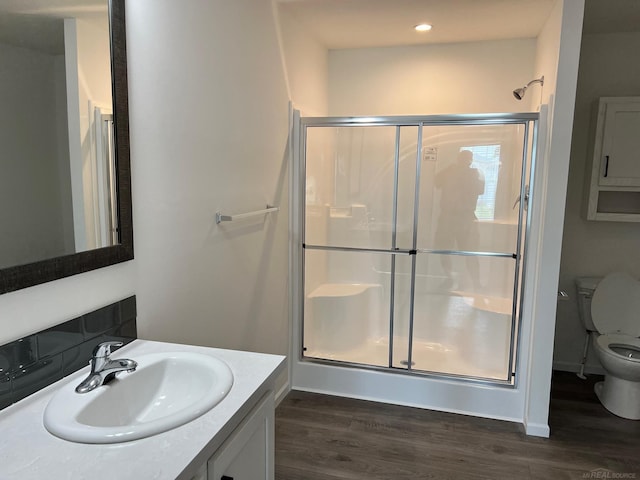 264 Westbrook Ct, Port Huron, MI 48060 - full bathroom with a stall shower, wood finished floors, vanity, and recessed lighting