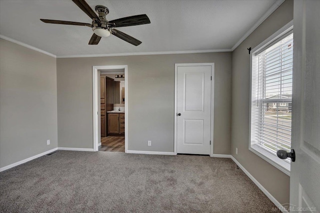 260 Meadow Ln, Port Huron, MI 48060 - unfurnished bedroom featuring crown molding, multiple windows, carpet floors, ensuite bathroom, and a ceiling fan