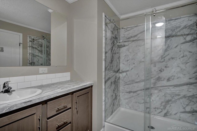 260 Meadow Ln, Port Huron, MI 48060 - bathroom with ornamental molding, vanity, a marble finish shower, a textured ceiling, and backsplash
