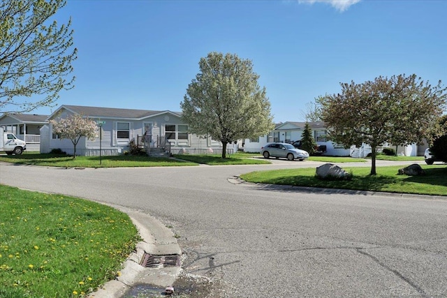 260 Meadow Ln, Port Huron, MI 48060 - view of asphalt road featuring a residential view and curbs