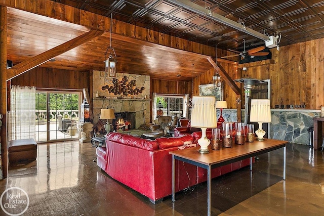5350 Brewster Rd, Oakland Twp, MI 48306 - living area featuring wood walls, vaulted ceiling, and a fireplace