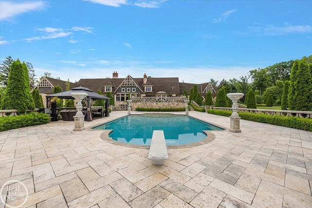 5350 Brewster Rd, Oakland Twp, MI 48306 - outdoor pool featuring a gazebo, a patio, and a diving board