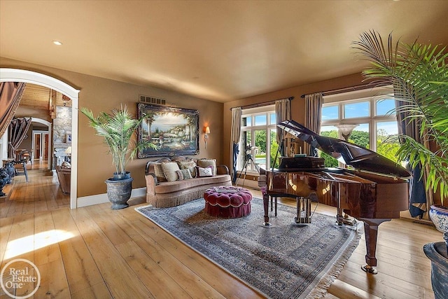 5350 Brewster Rd, Oakland Twp, MI 48306 - sitting room featuring arched walkways and hardwood / wood-style floors