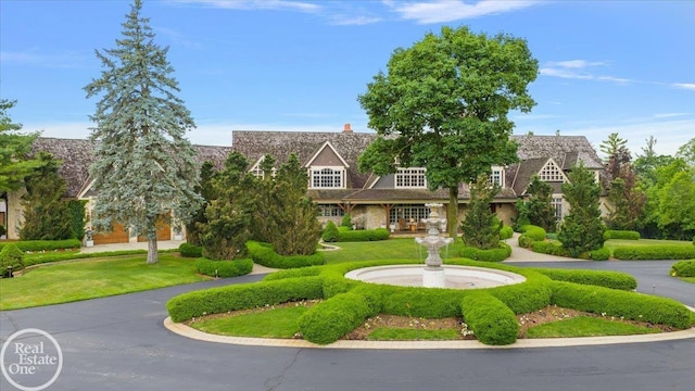 5350 Brewster Rd, Oakland Twp, MI 48306 - tudor home featuring stone siding