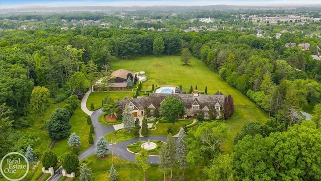 5350 Brewster Rd, Oakland Twp, MI 48306 - view from above of property with a heavily wooded area