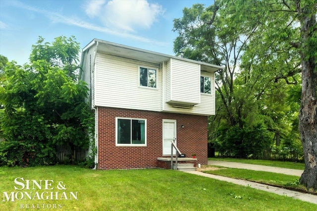 3032 24th St, Port Huron, MI 48060 - view of front facade with brick siding and a front lawn