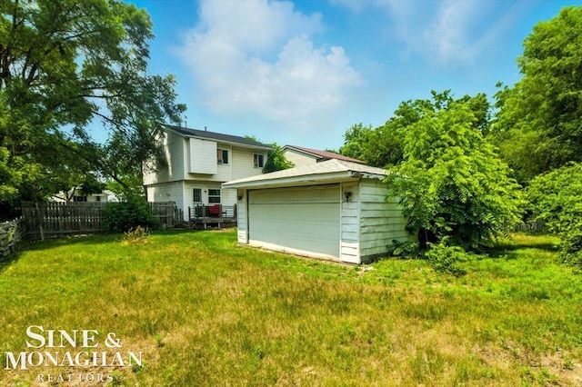 3032 24th St, Port Huron, MI 48060 - back of house featuring an outbuilding and a detached garage